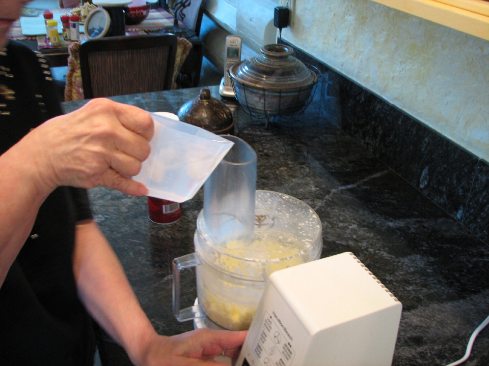 Adding Ice Water To Food Processor During Butter Making Process