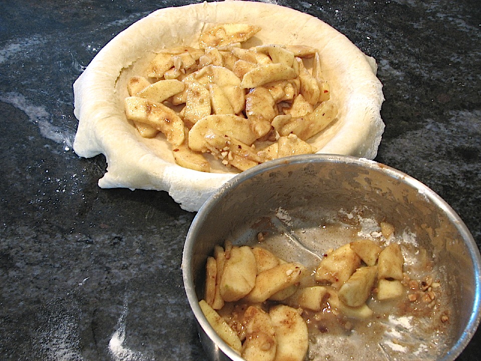 Putting the filling in the rolled out pie dough